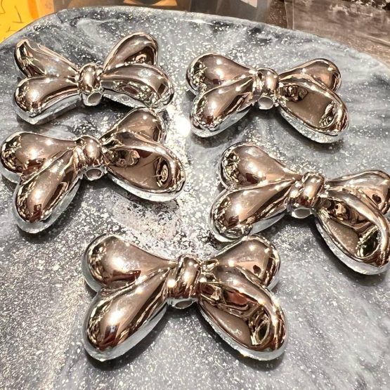 (BP257) 4 x 23mm metallic bow beads